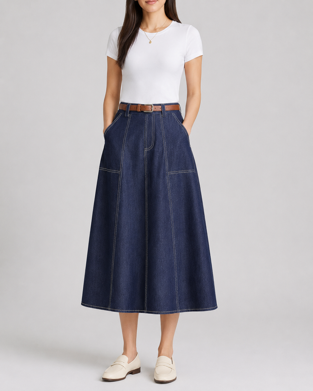 Navy A-line denim midi skirt with belt, worn front view