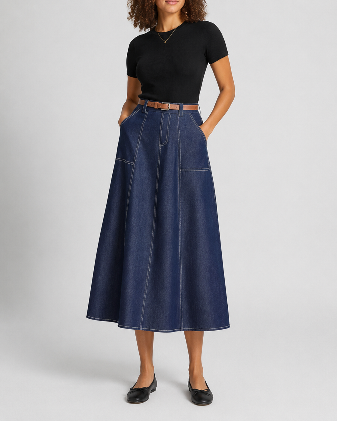 Navy denim A-line midi skirt, front angle on model