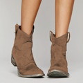 Brown distressed western ankle boots, worn