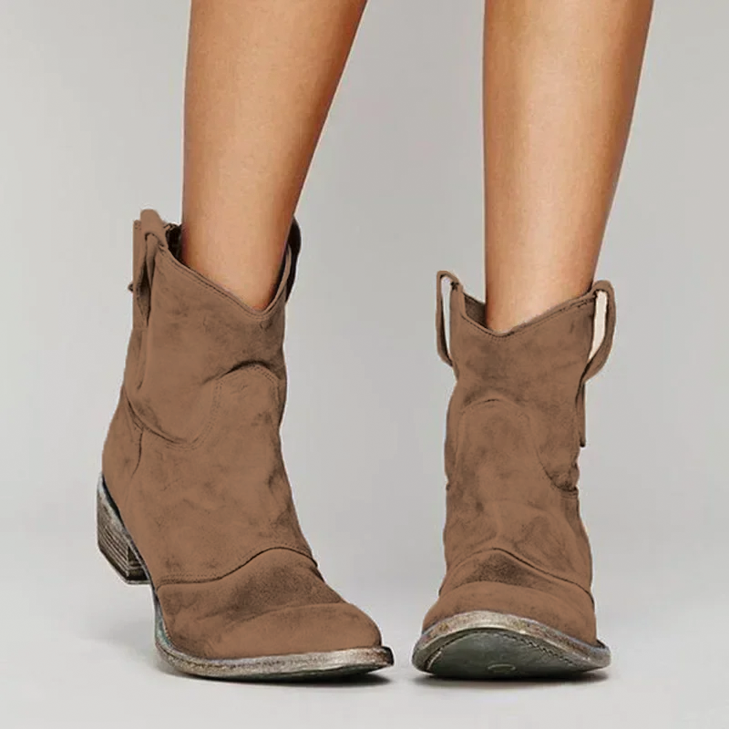 Brown distressed western ankle boots, worn