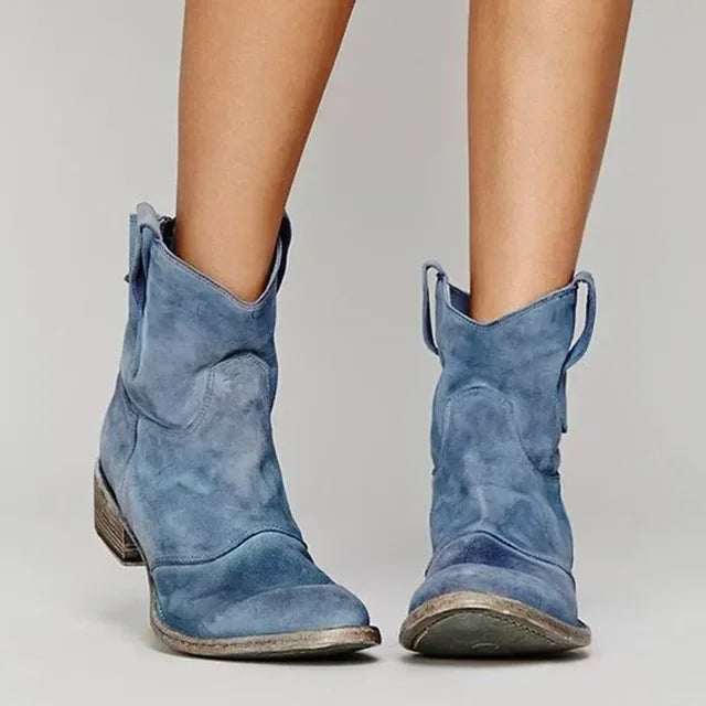Blue distressed western ankle boots, worn