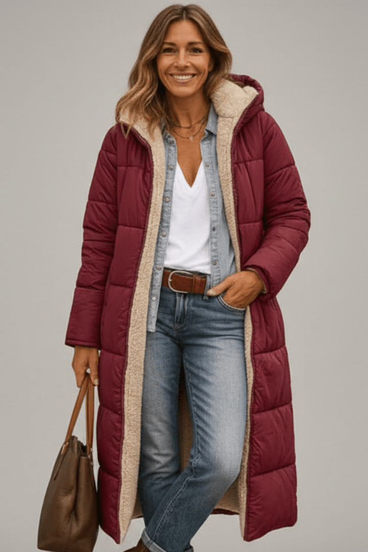 Burgundy hooded longline puffer coat, front on model