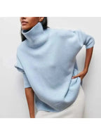 Orange oversized turtleneck knit sweater, front