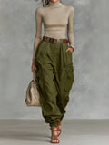 Army green parachute cargo pants, on model