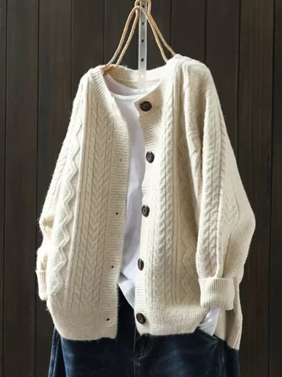 Beige oversized cable-knit button-down cardigan, front