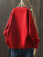 Oversized cable-knit cardigan, back view