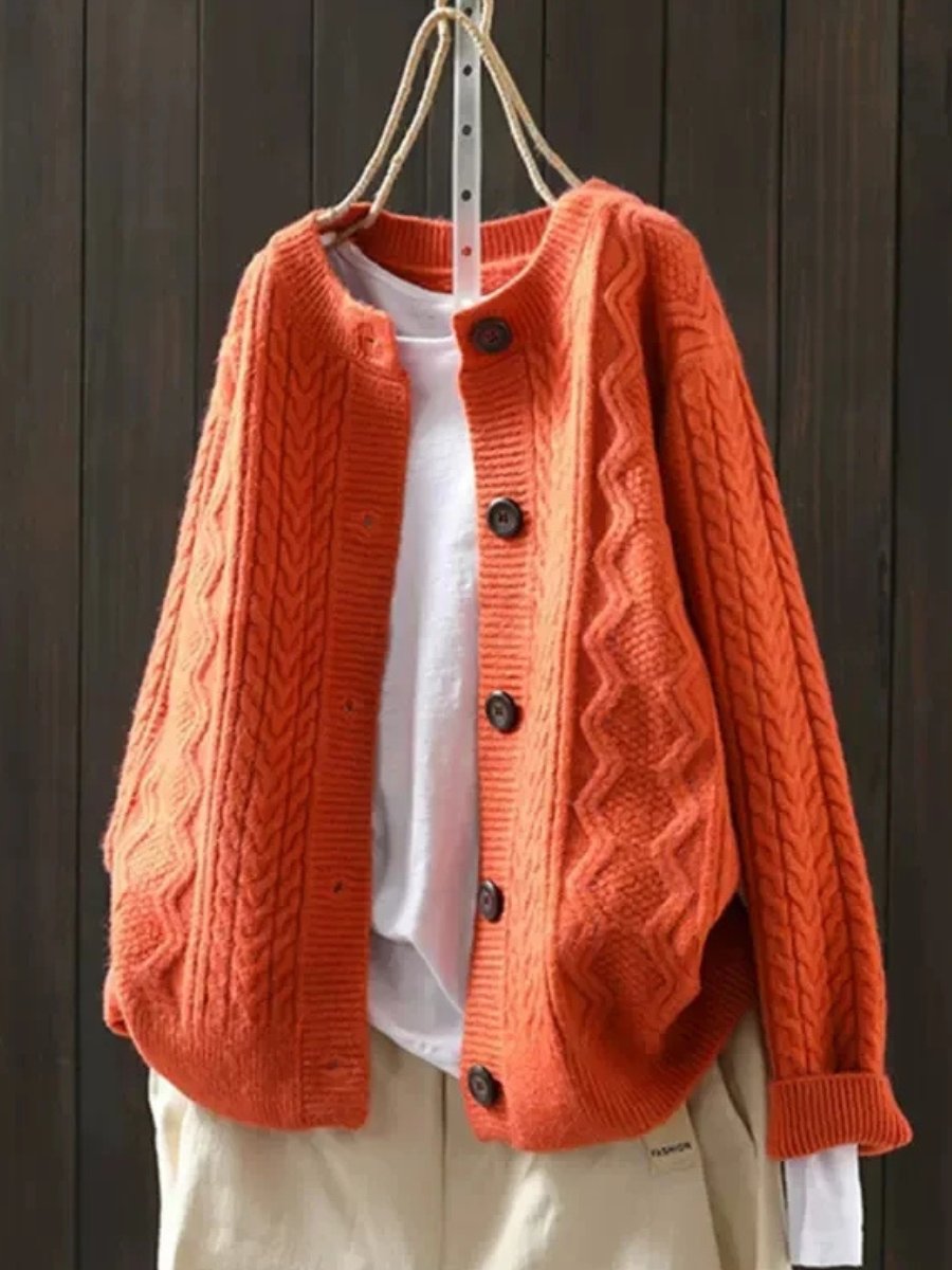 Orange oversized cable-knit cardigan, front